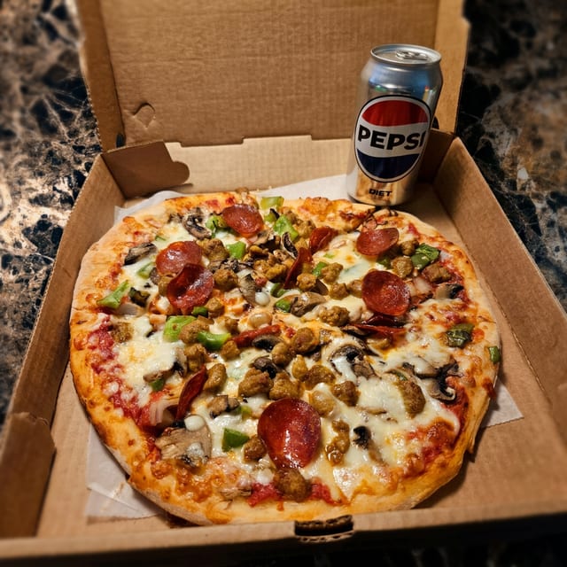 Any Medium Pizza & Can of Soda.